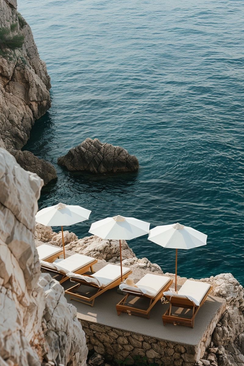 Cliffside sun loungers above the Adriatic