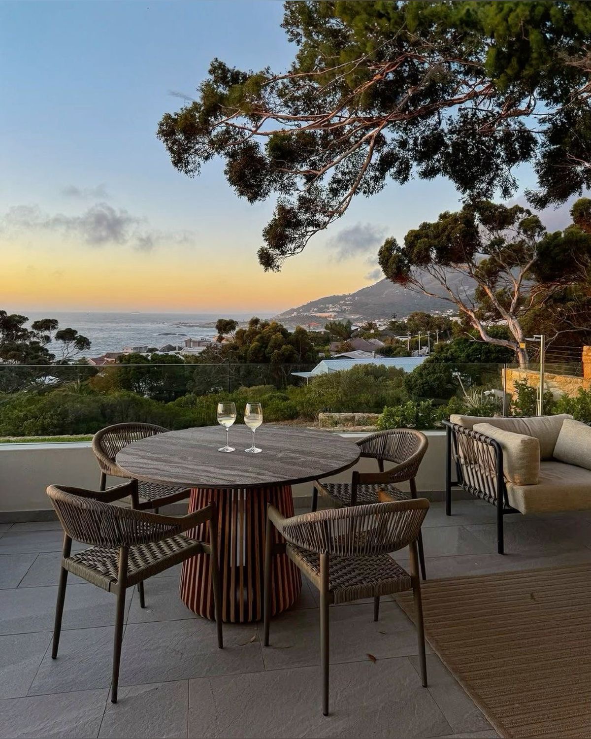 Sunset terrace dinner above the ocean
